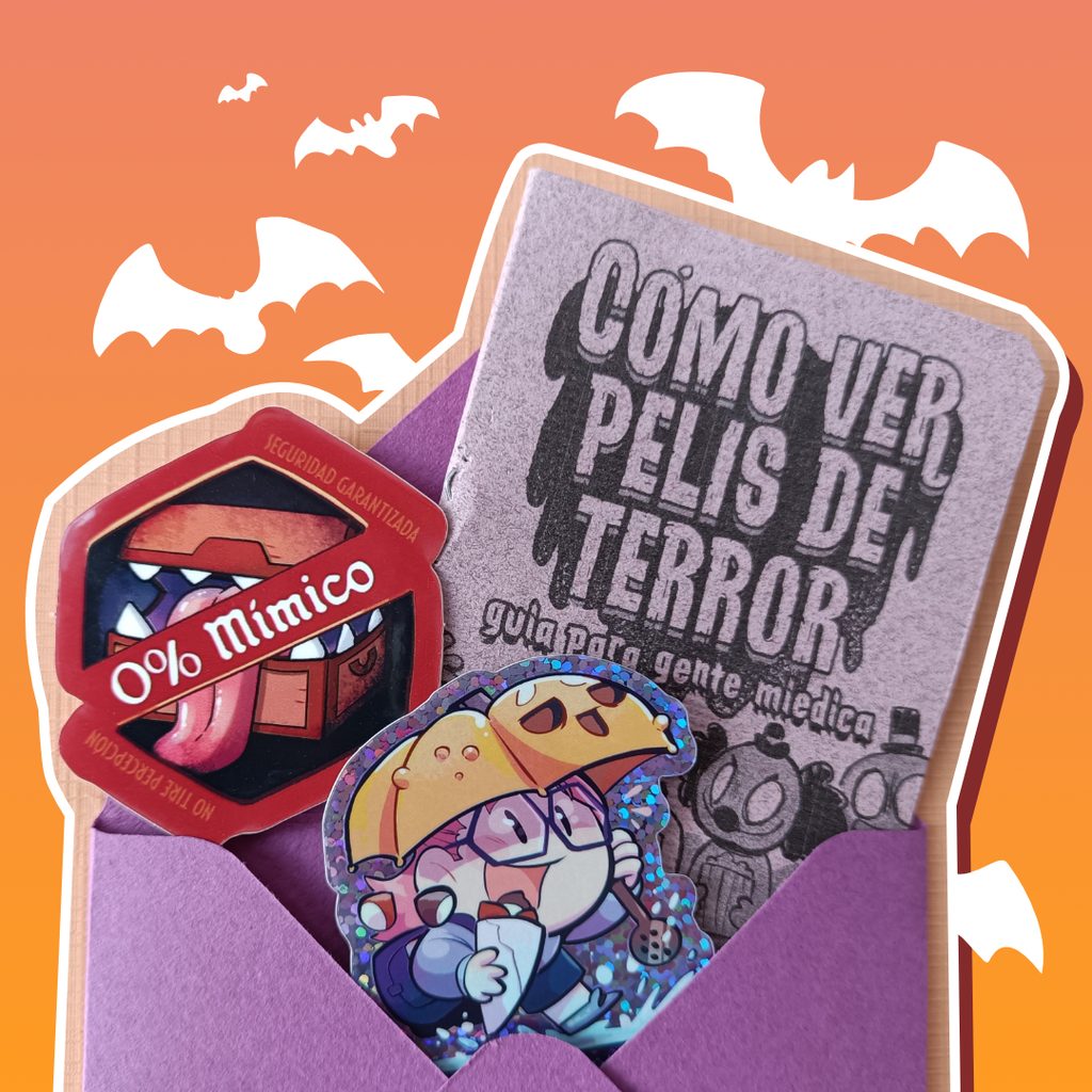 Imagen de la carta de otoño, un sobre morado abierto del que salen dos pegatinas y un minicómic titulado Cómo ver pelis de terror